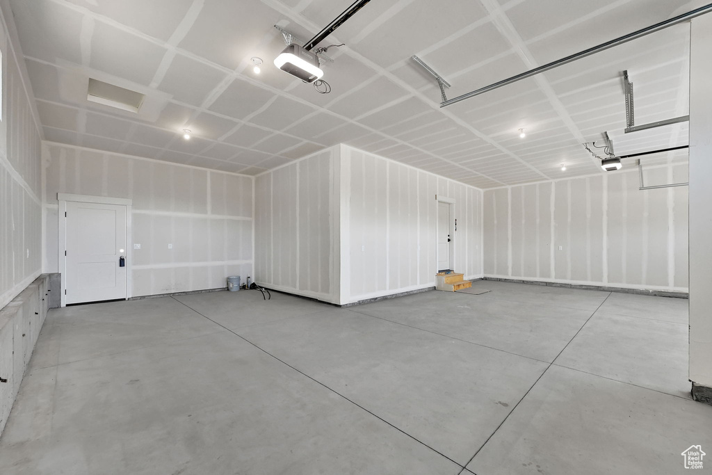 Garage featuring a garage door opener