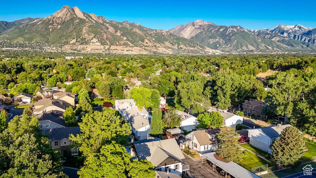 Aerial view of residential area featuring mountains