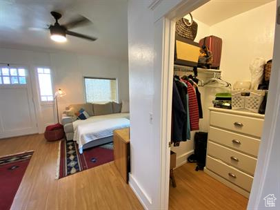 Bedroom with wood finished floors and ceiling fan