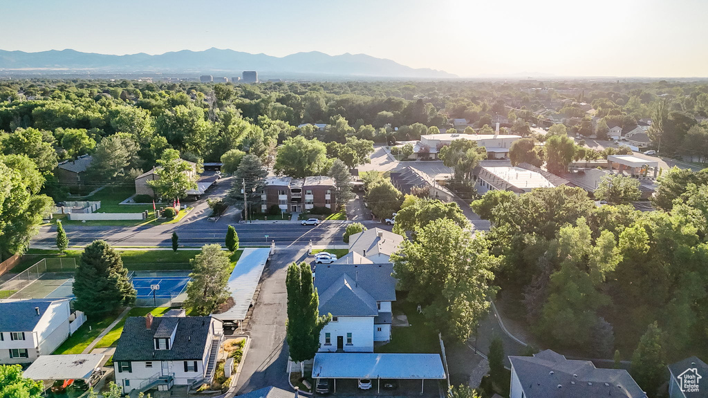 Aerial view of residential area featuring a mountainous background