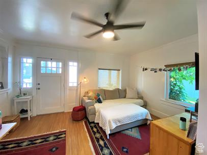 Bedroom featuring wood finished floors and ceiling fan