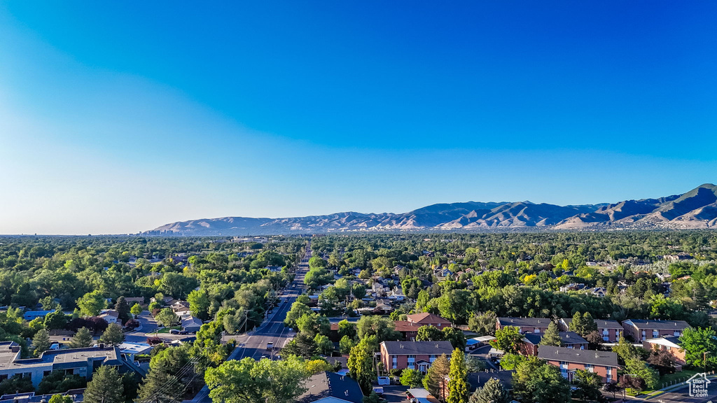 Aerial view of residential area featuring mountains