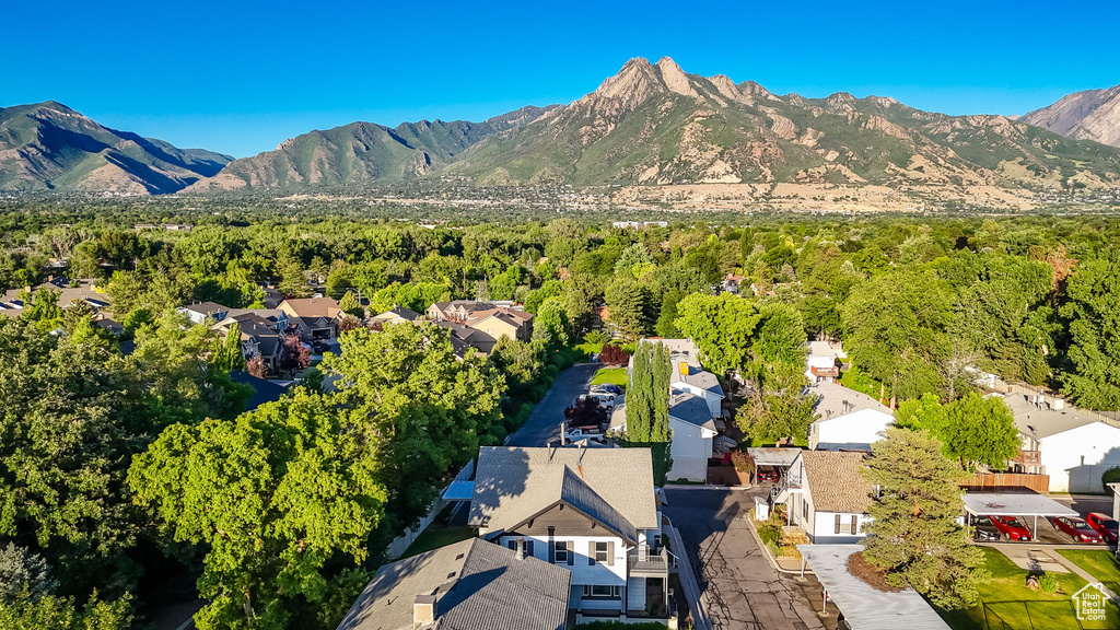 Aerial view of residential area featuring a mountain backdrop