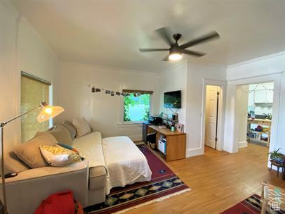 Bedroom featuring wood finished floors and a ceiling fan