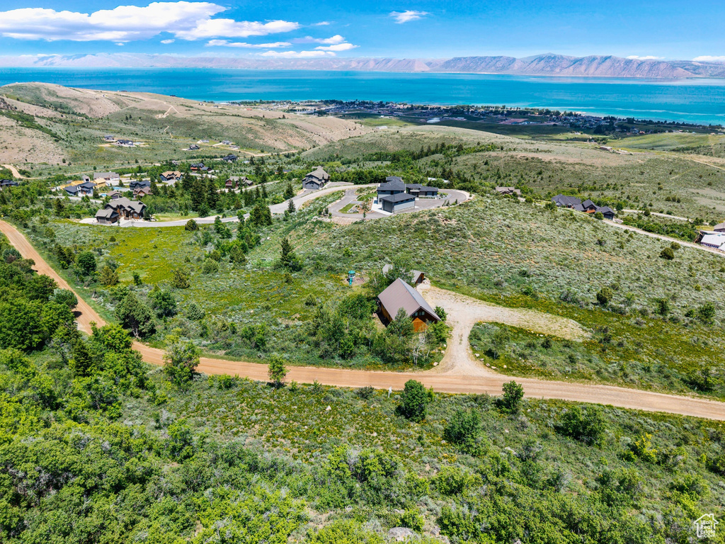 View of property location with a water and mountain view