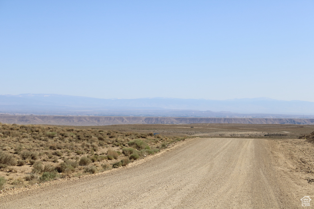 View of mountain backdrop featuring rural landscape