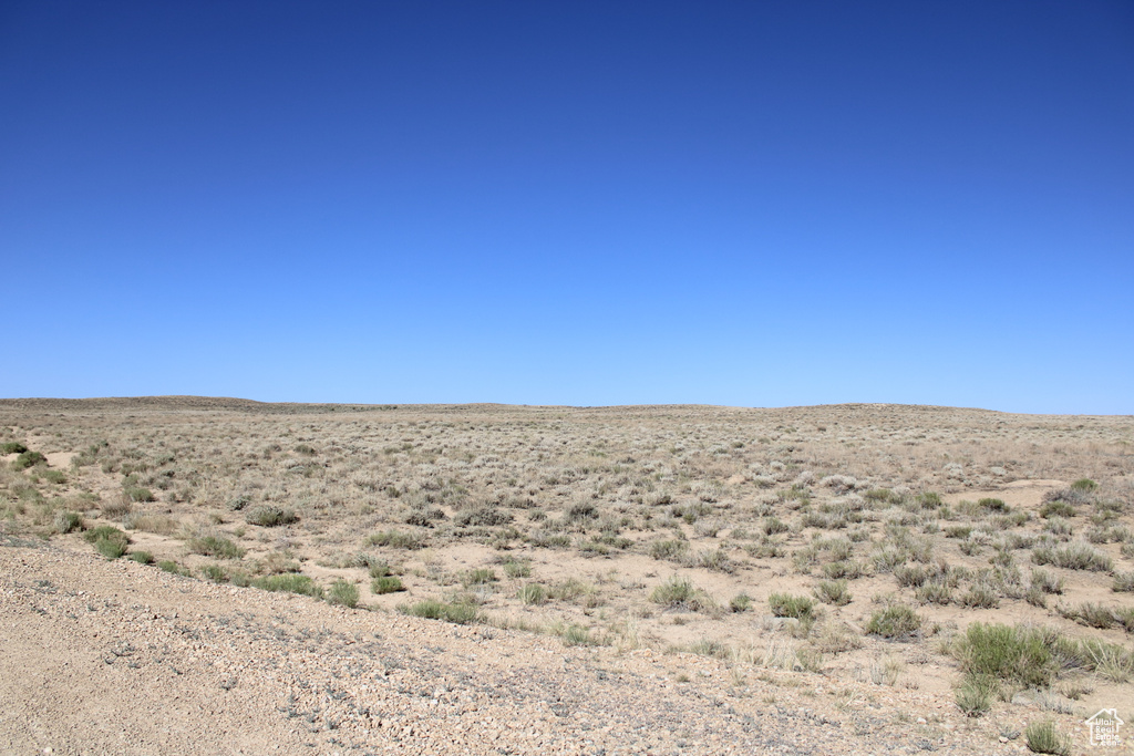 View of mountain backdrop with rural landscape