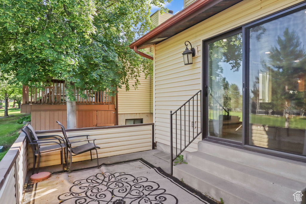 Wooden terrace featuring entry steps