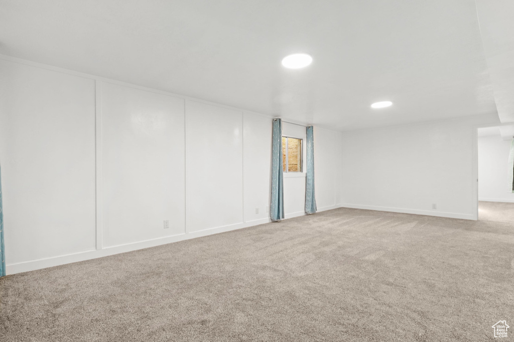Empty room featuring carpet and recessed lighting
