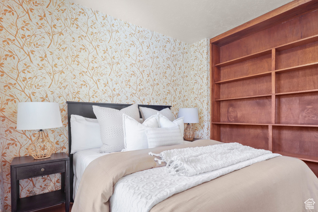Bedroom with wallpapered walls