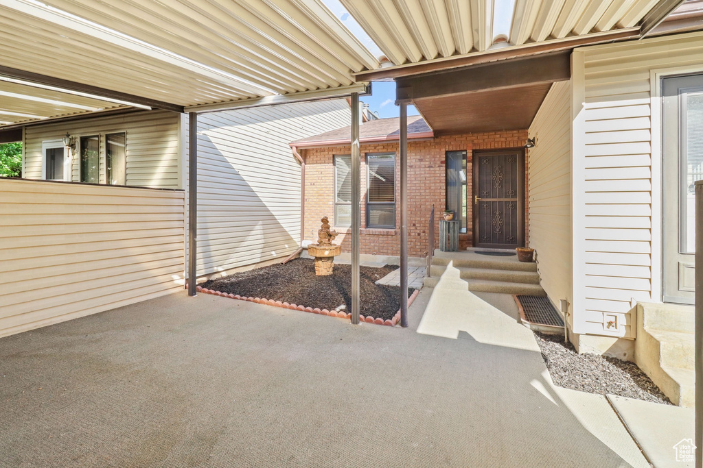 Entrance to property with brick siding