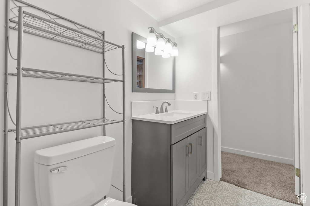 Bathroom featuring toilet and vanity