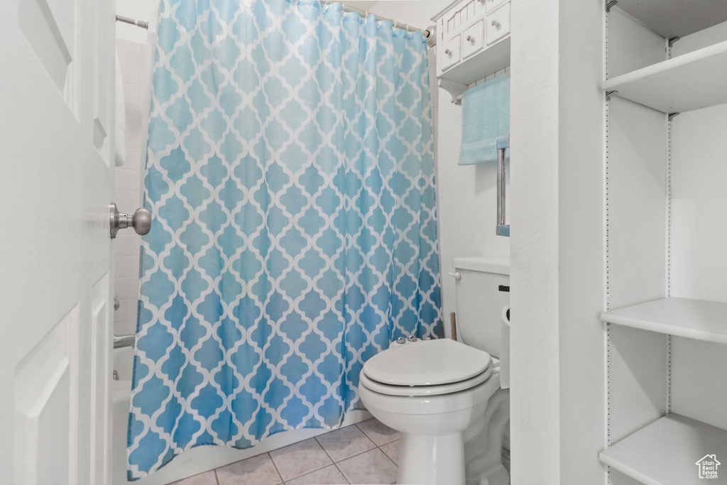 Full bathroom with tile patterned flooring and toilet