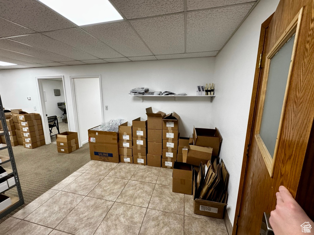 Tiled office space with a drop ceiling