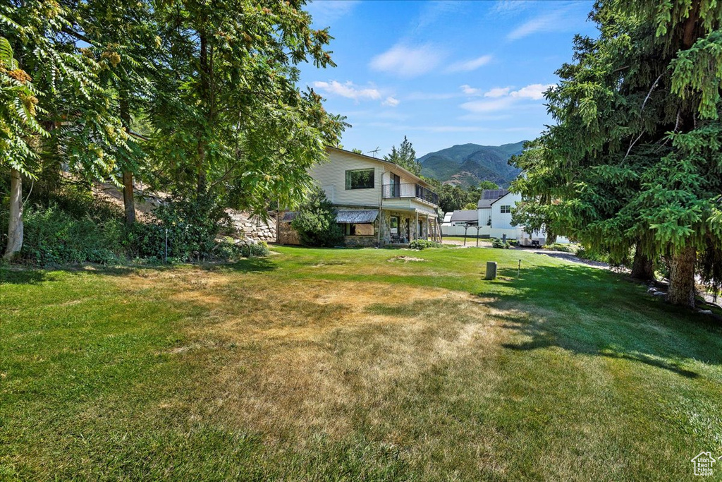 View of green lawn with a mountain view
