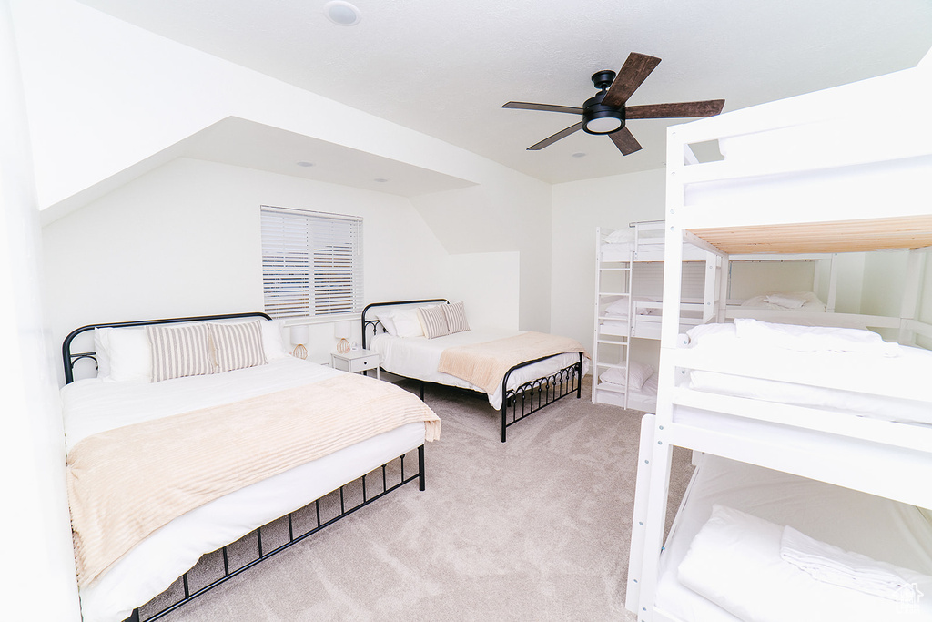 Bedroom featuring carpet and a ceiling fan