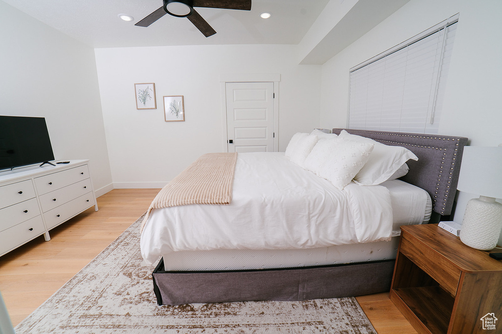 Bedroom with light wood-style floors, recessed lighting, and ceiling fan
