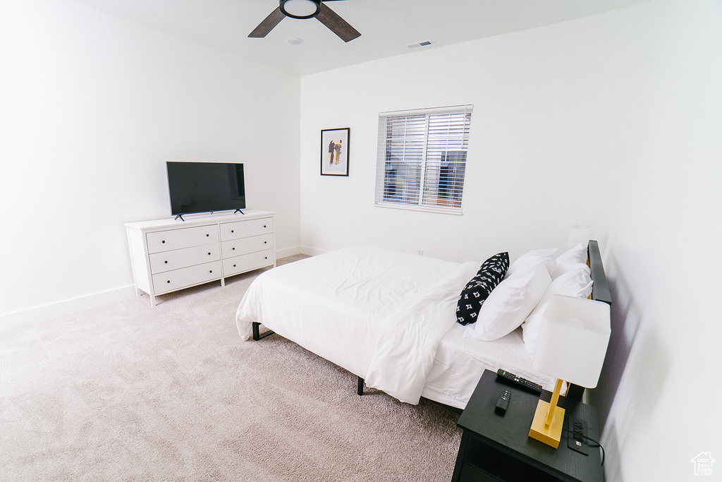 Bedroom featuring carpet floors and ceiling fan