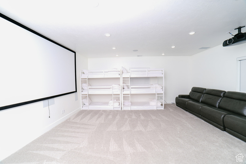 Home theater featuring carpet and recessed lighting