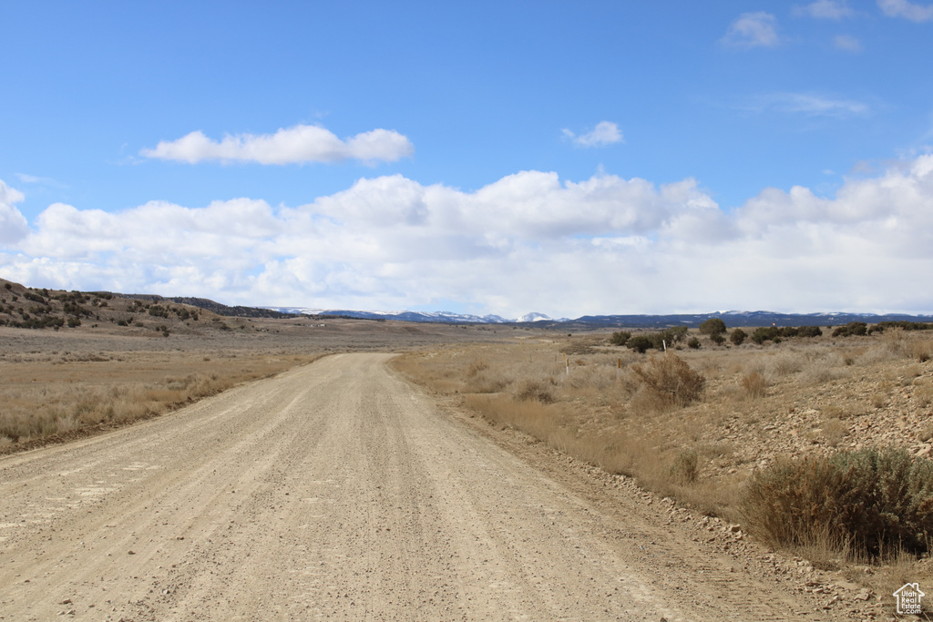 View of dirt / gravel road featuring a rural view