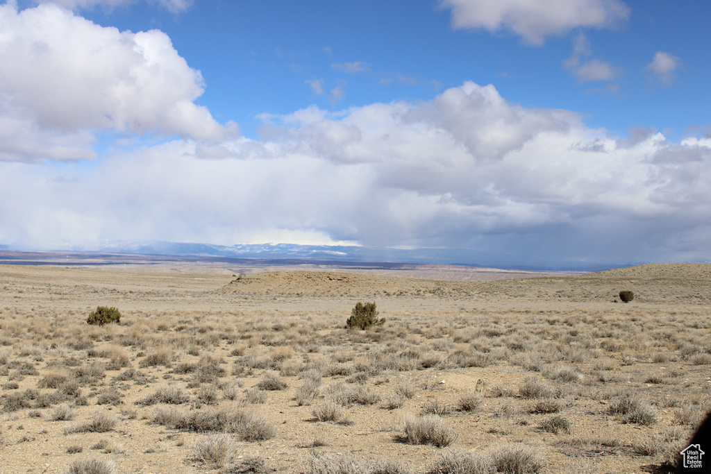 View of mountain backdrop with a desert landscape and rural landscape