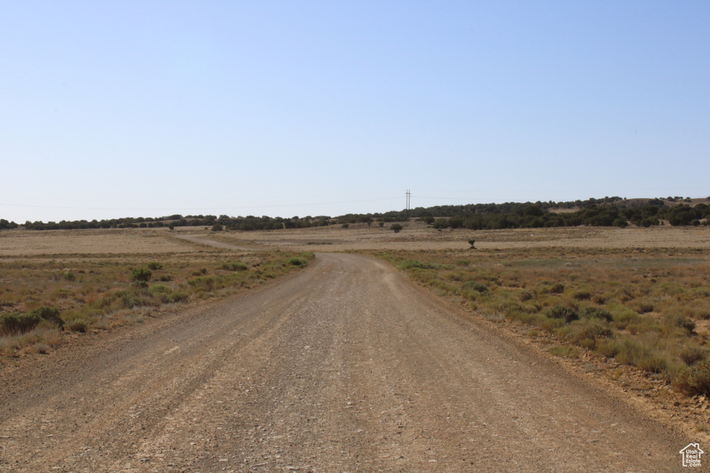 View of dirt / gravel road with a view of countryside