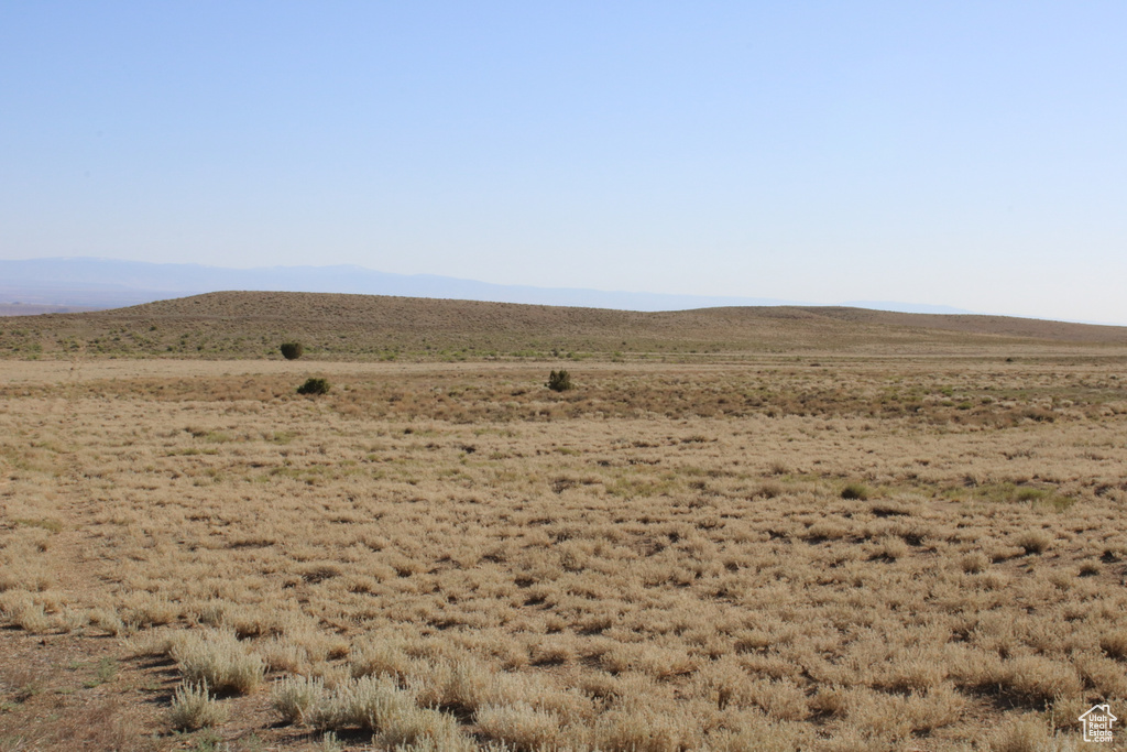 View of mountain backdrop with rural landscape