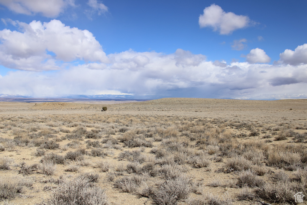 View of mountain background featuring rural landscape