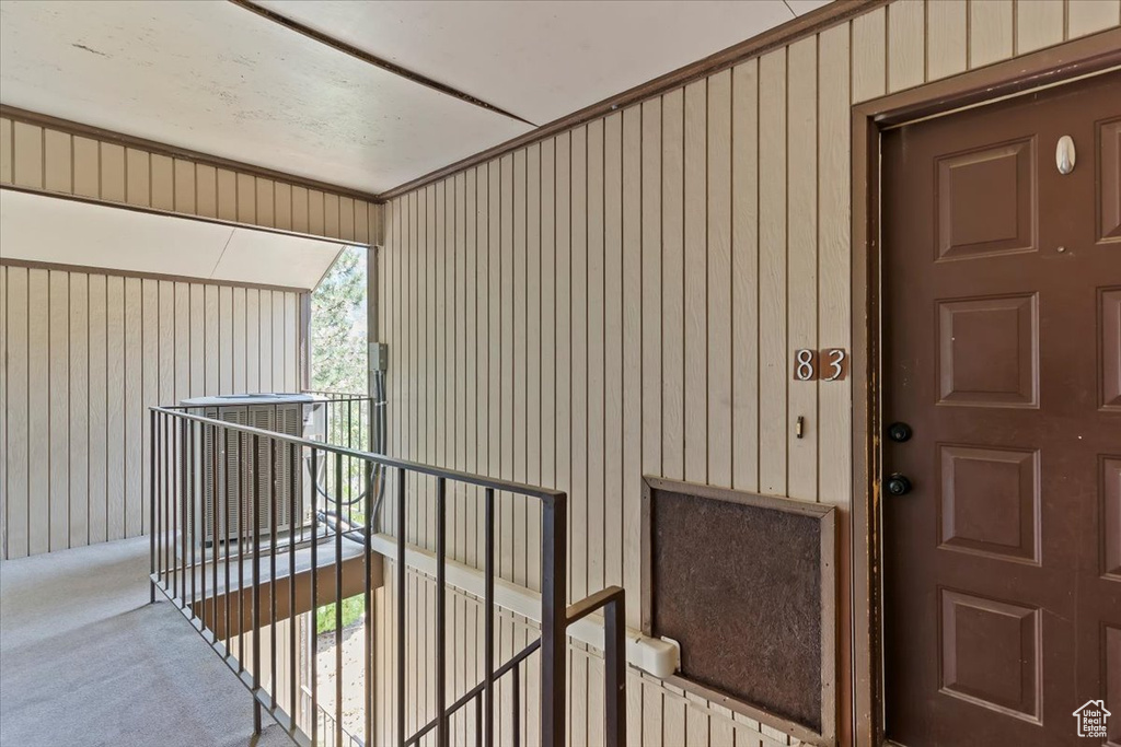 View of exterior entry featuring board and batten siding
