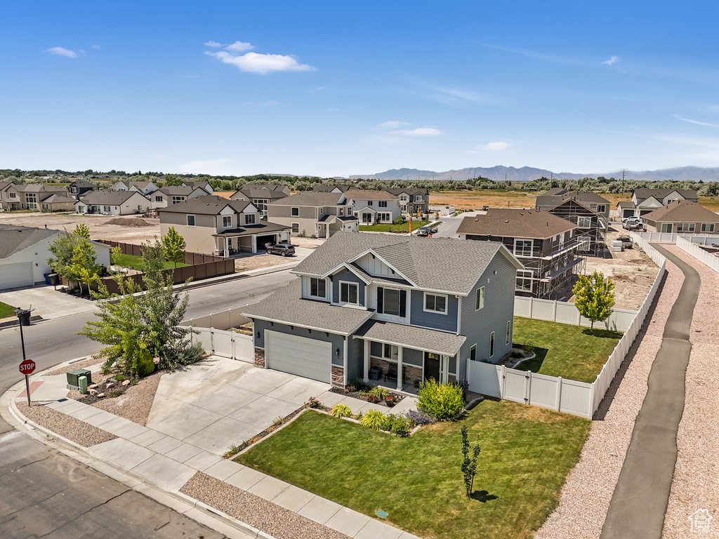 Aerial perspective of suburban area featuring a mountain backdrop