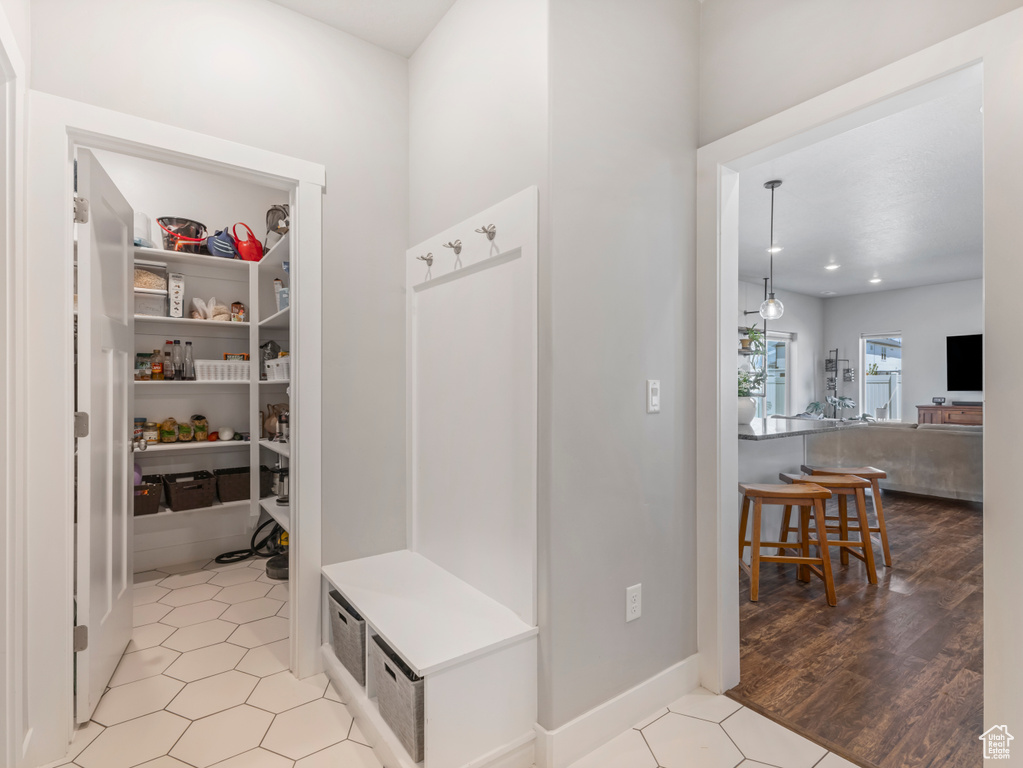 Mudroom with light tile patterned floors