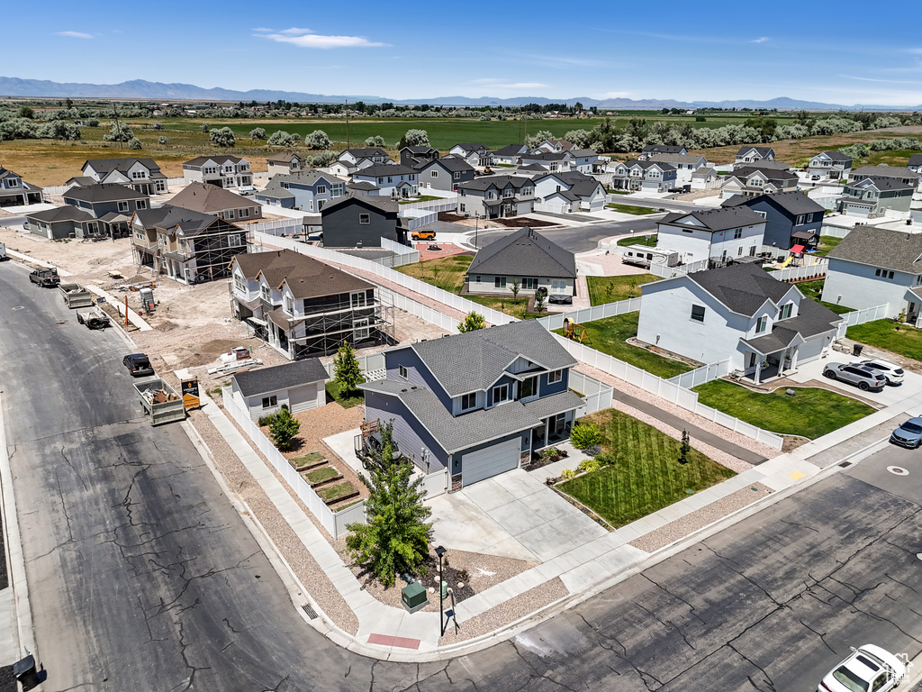 Aerial perspective of suburban area with a mountain backdrop