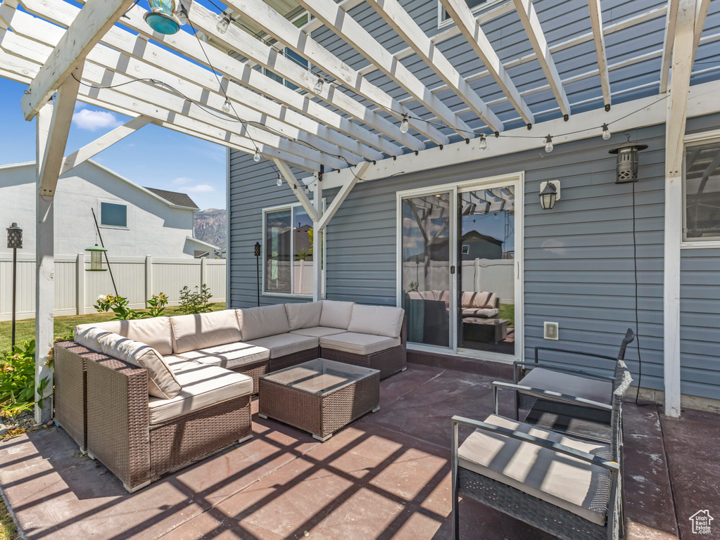 View of patio featuring outdoor lounge area and a pergola