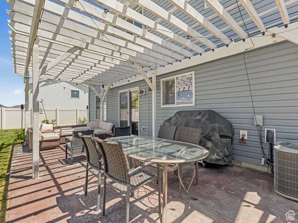 View of patio with an outdoor hangout area, a pergola, a grill, and outdoor dining area