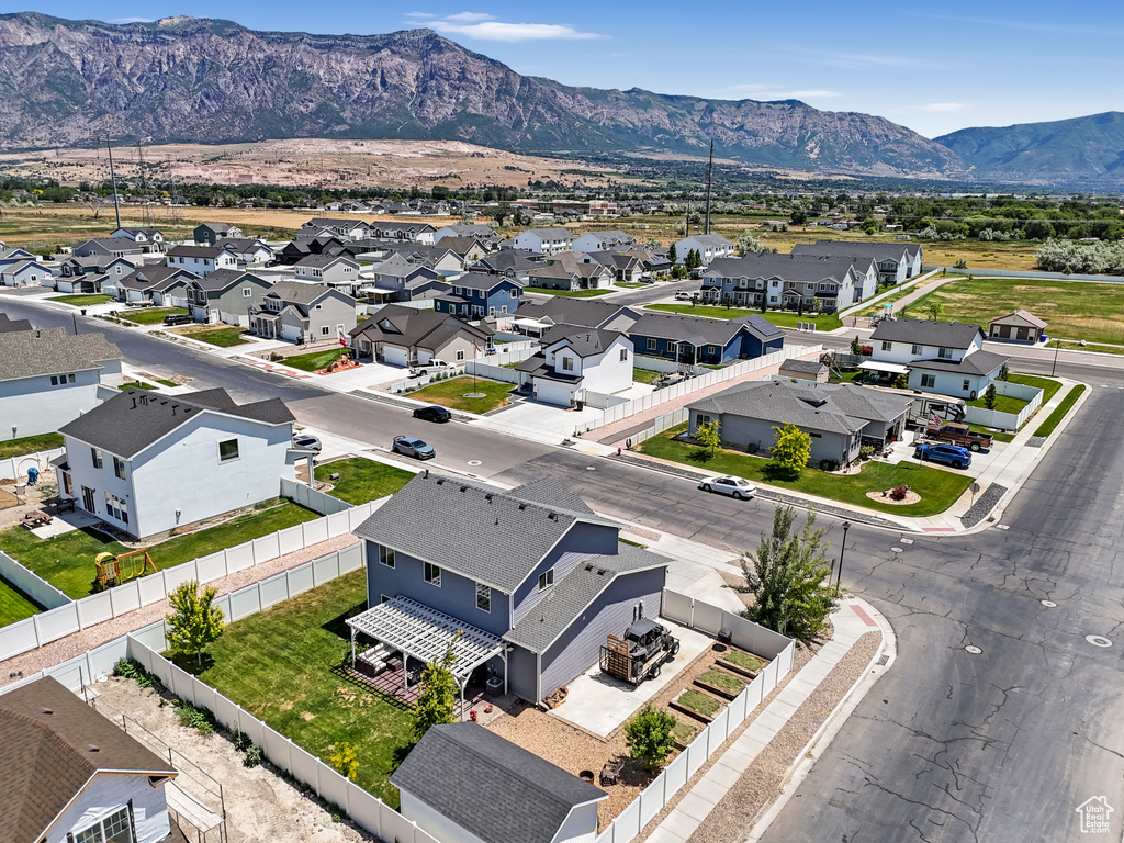 Aerial perspective of suburban area featuring a mountain backdrop