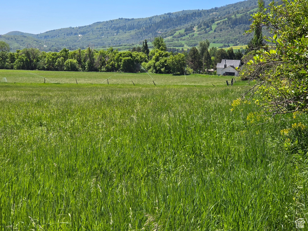 View of mountain backdrop with rural landscape