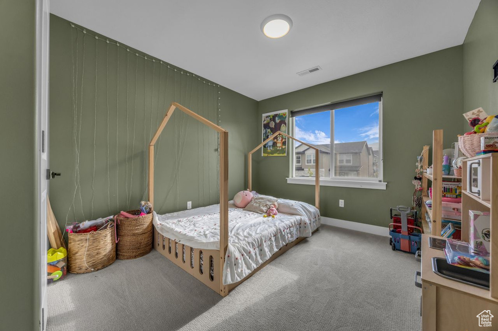 Carpeted bedroom with baseboards