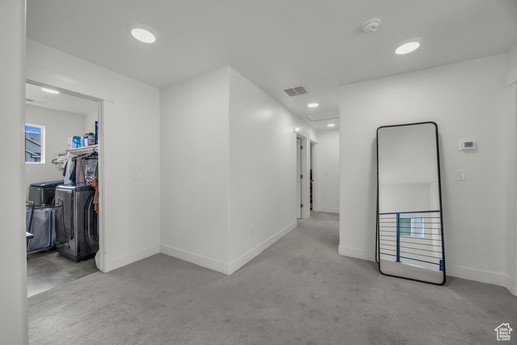 Hallway with carpet flooring and recessed lighting