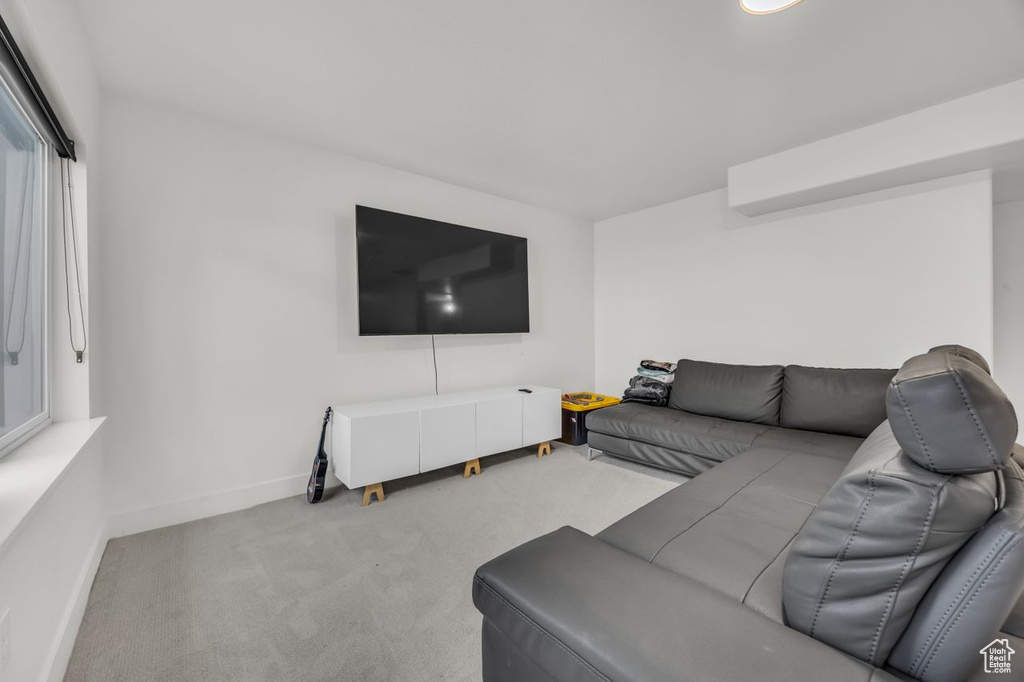 Carpeted living room with baseboards