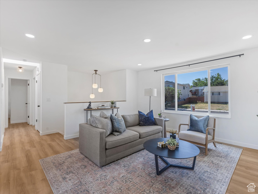 Living room featuring light wood-style floors and recessed lighting