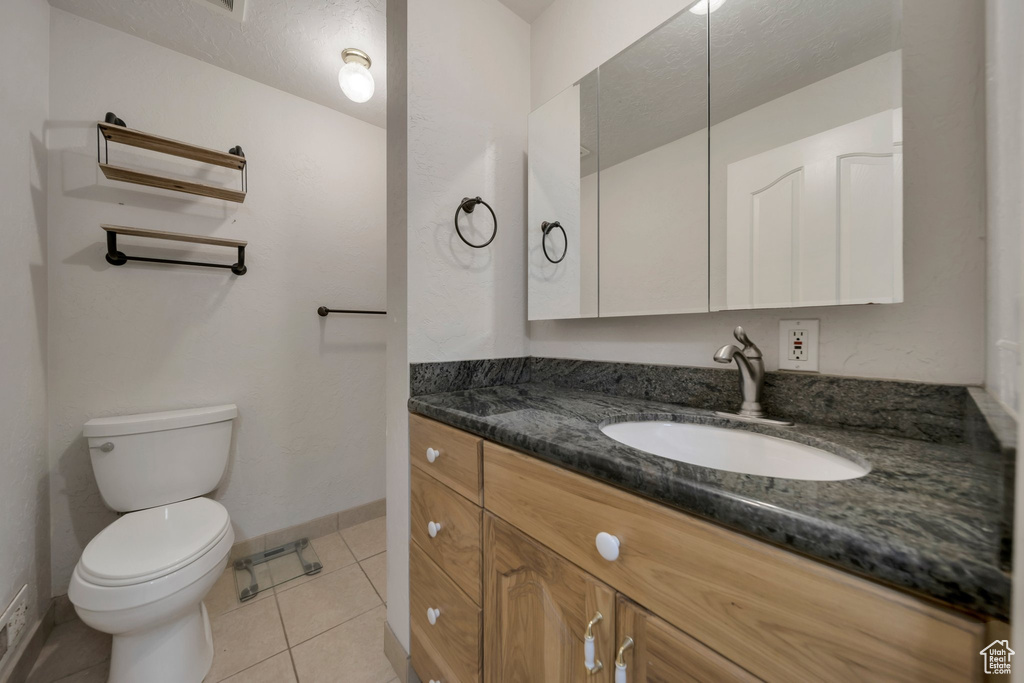 Bathroom with vanity and tile patterned floors