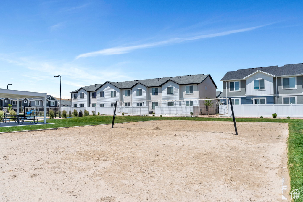 Surrounding community featuring a residential view and volleyball court