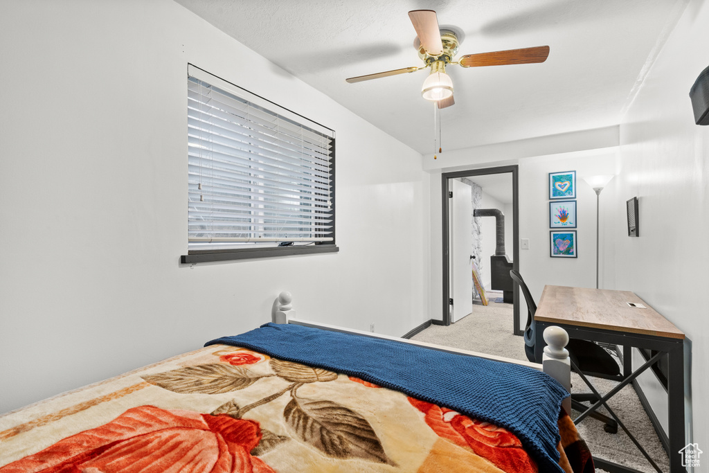 Bedroom featuring carpet floors and a ceiling fan