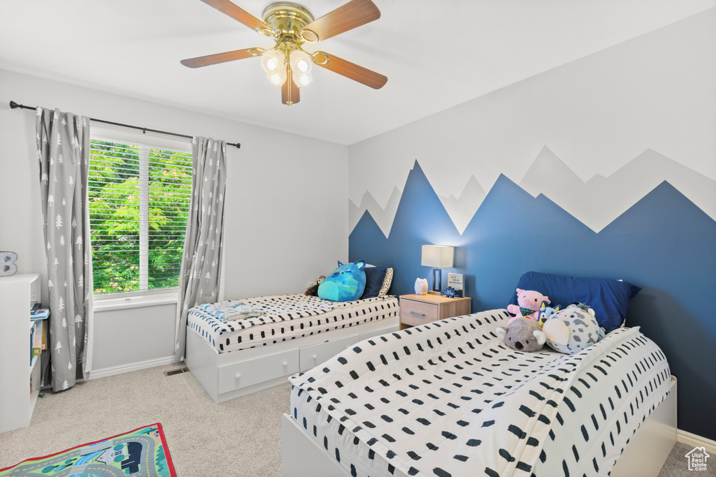 Bedroom with carpet flooring and ceiling fan