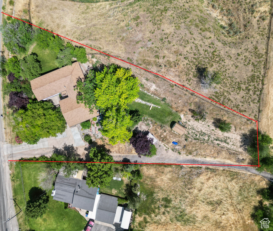Aerial overview of property\'s location featuring property parcel outlined