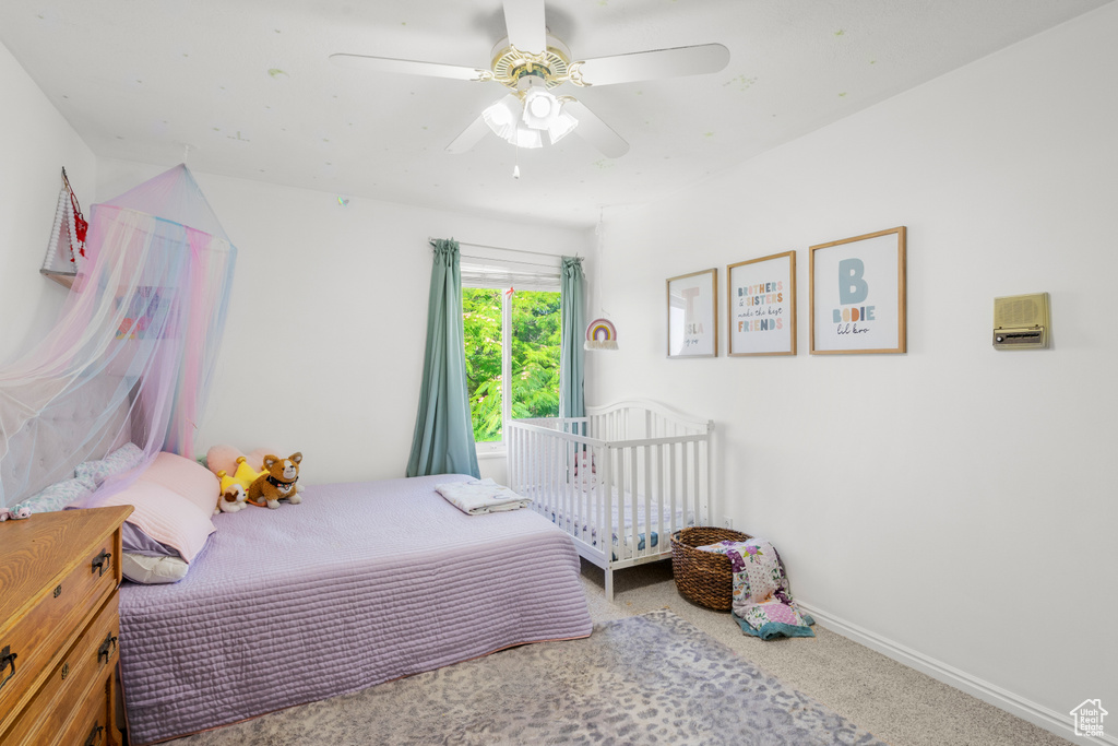Bedroom with carpet and ceiling fan