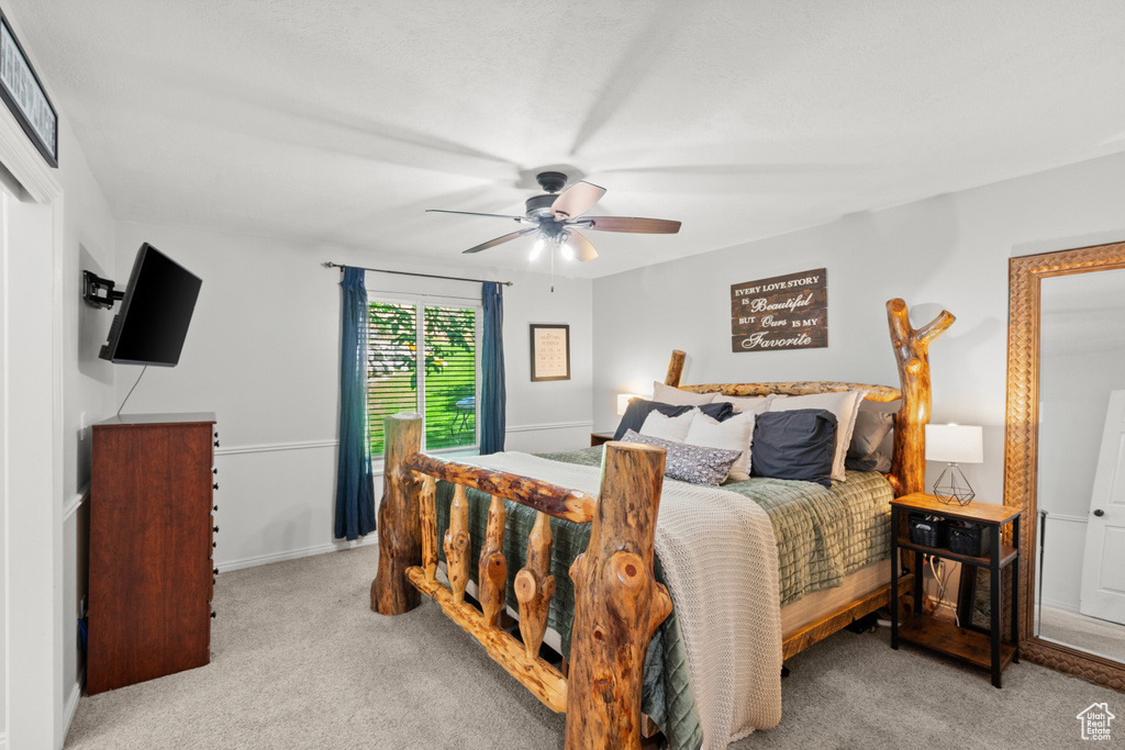 Bedroom with carpet flooring and ceiling fan