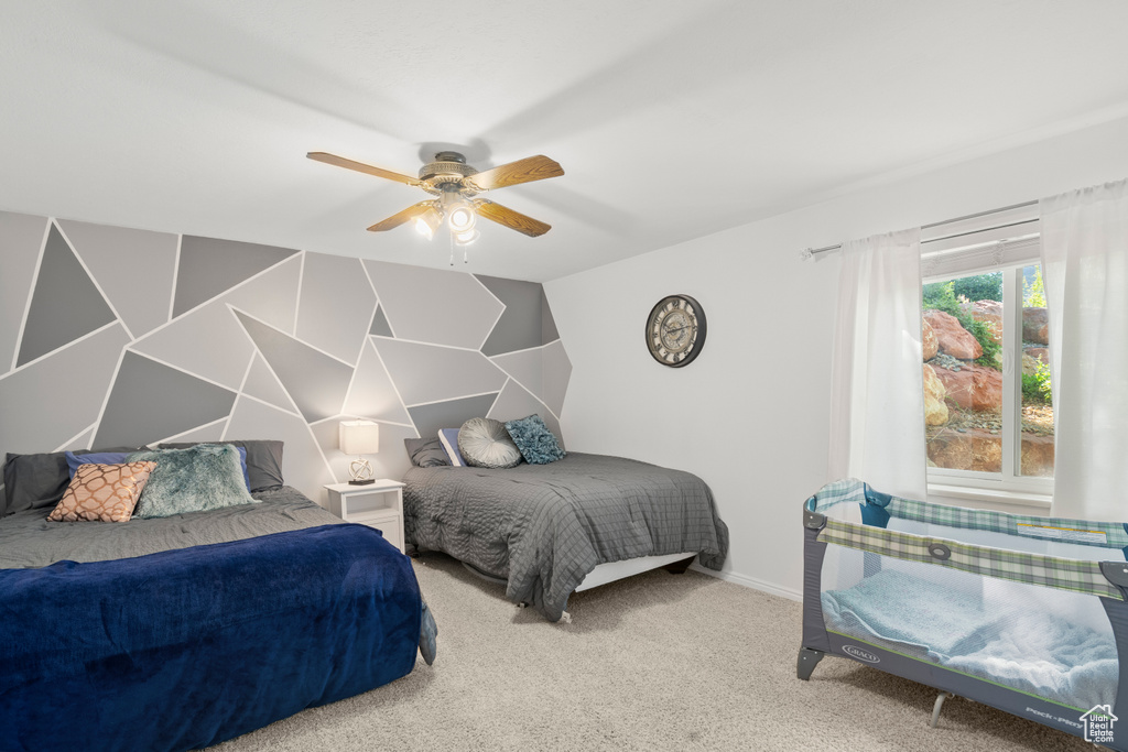 Bedroom featuring carpet and ceiling fan