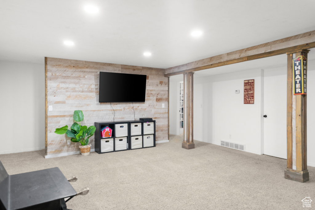 Living area featuring carpet floors and recessed lighting