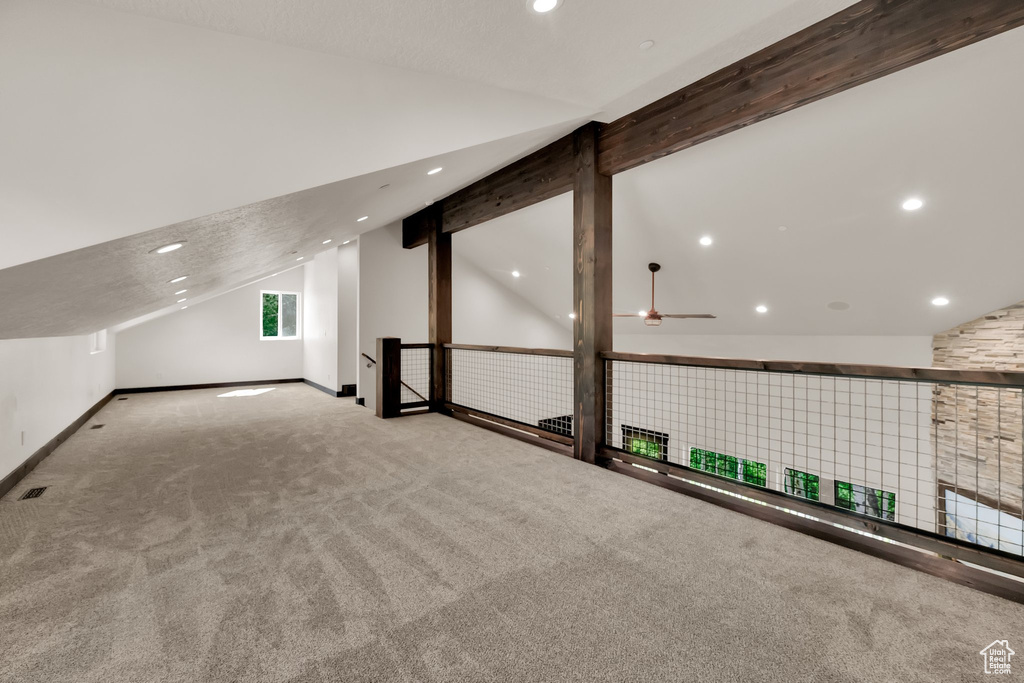 Additional living space with lofted ceiling, carpet, recessed lighting, and a ceiling fan